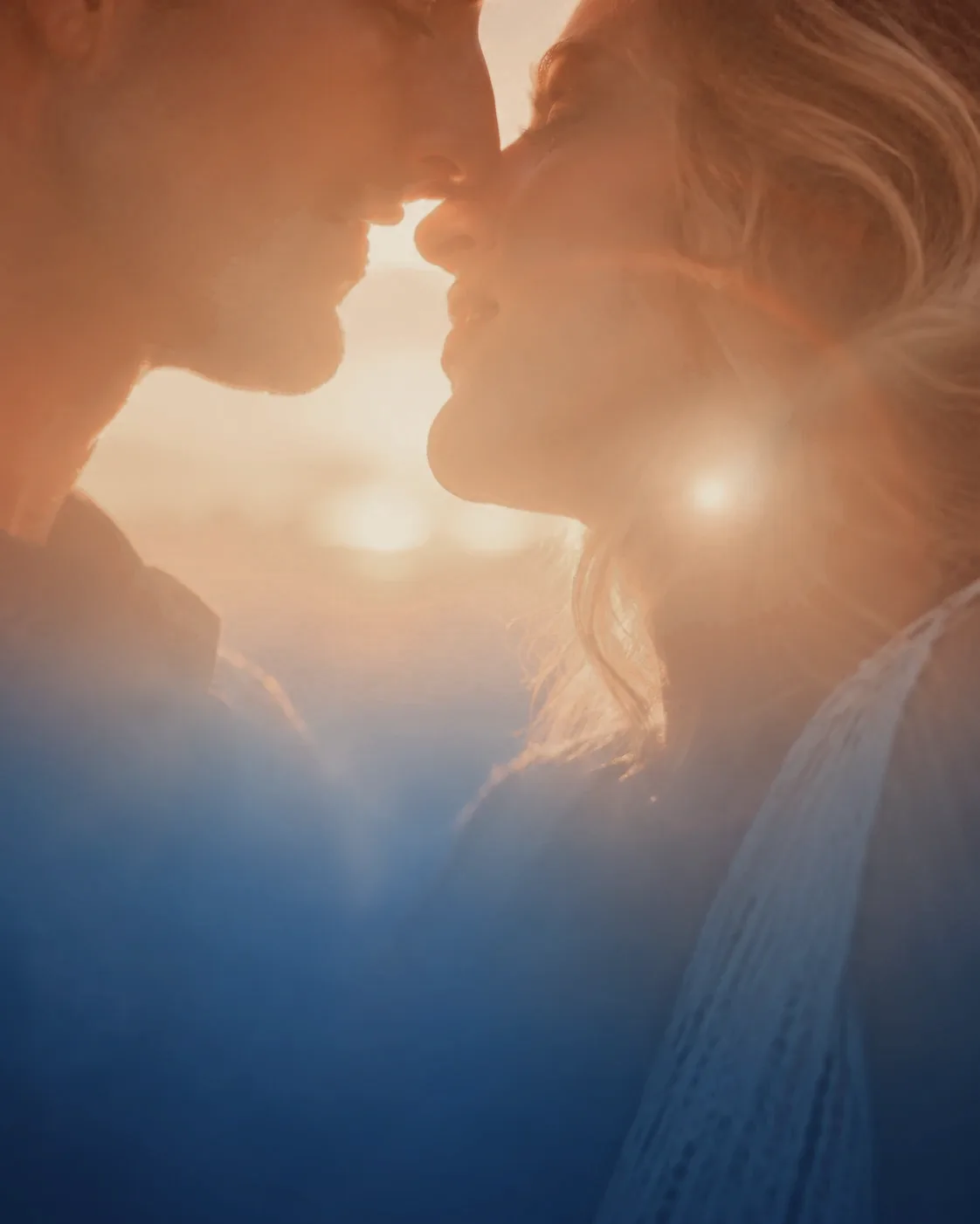 A couple forehead to forehead at sunset, reconnecting through relationship mediation