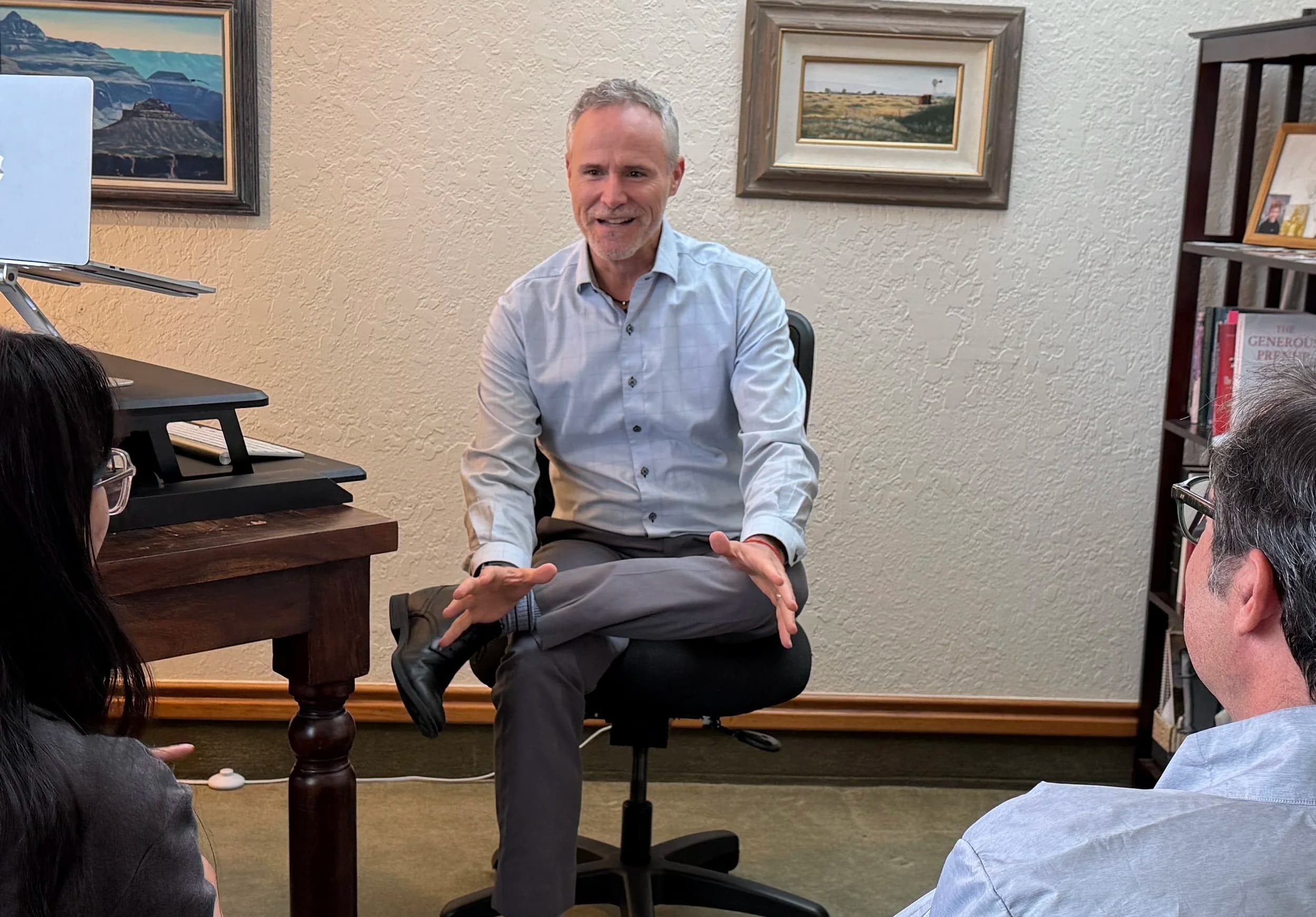 John Hoelle mediating with a couple at the firm's office